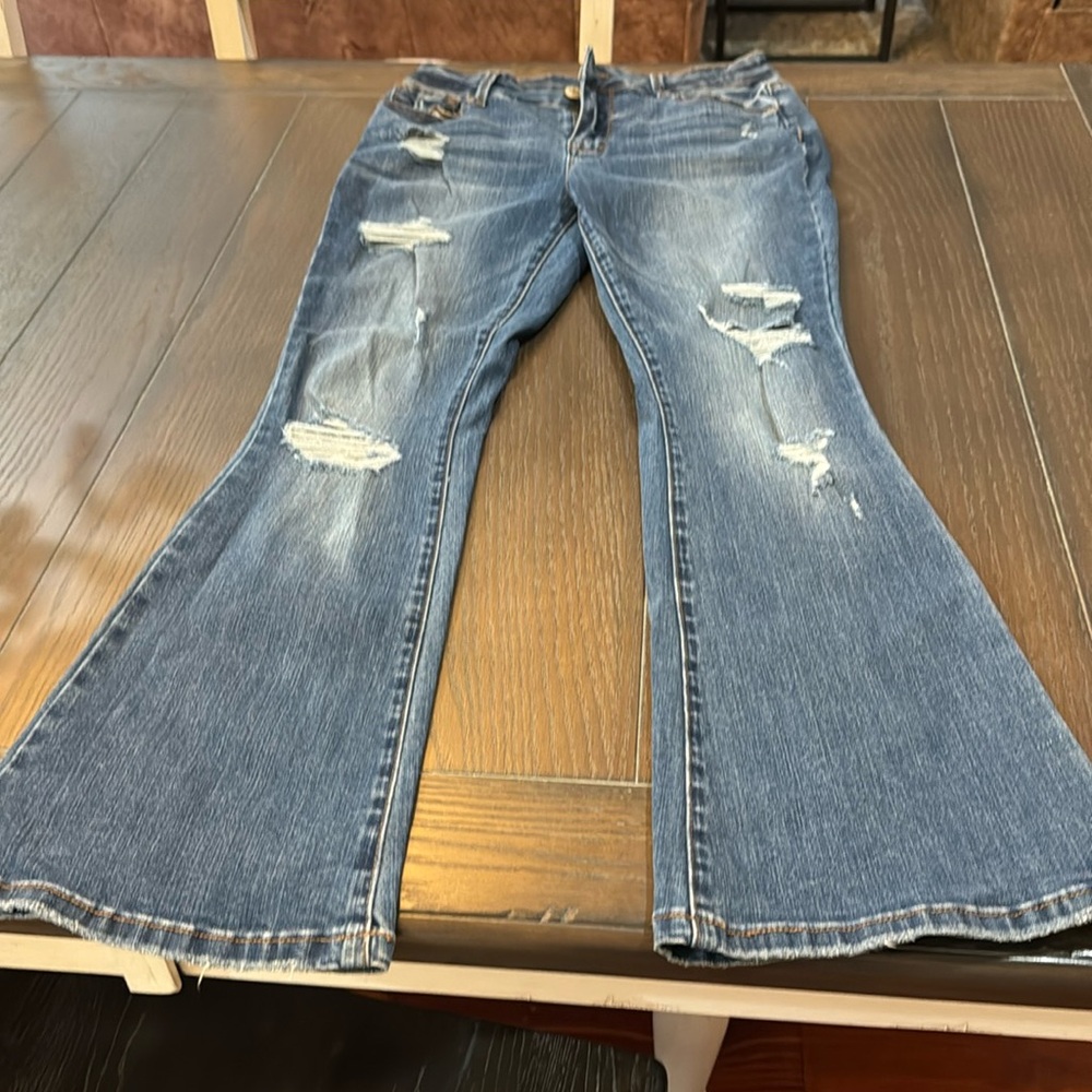 Maurice’s size 6 short distressed high rise flare jeans